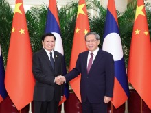李強會見老撾人民革命黨中央總書記、國家主席通倫