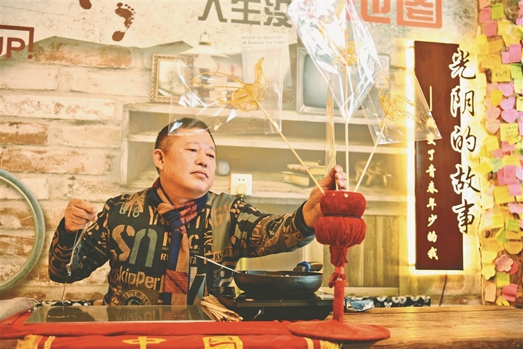 非遺糖畫添彩雪鄉