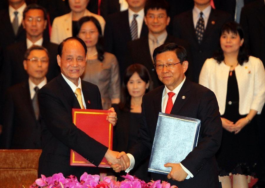 圖片默認標題 圖片默認標題_fororder_兩岸兩會領導人第九次會談于2013年6月21日在上海舉行,雙方由海協會會長陳德銘與海基會董事長林中森簽署《海峽兩岸服務貿易協議》。