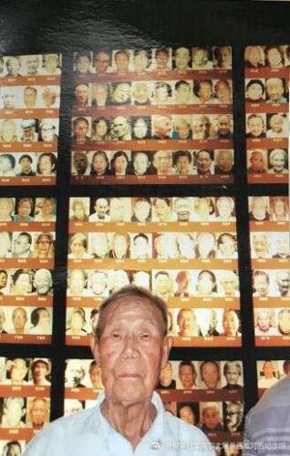  An identity certificate shows Guan Guangjing was recognized as the oldest survivor of the Nanjing Massacre. [Photo: Xinhua]