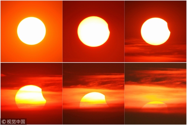 Combinaison de photos prise le 11 août 2018, montrant le processus d'une éclipse solaire partielle vue à Changzhou, dans la province du Jiangsu (est de la Chine).